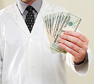 Doctor holding cash