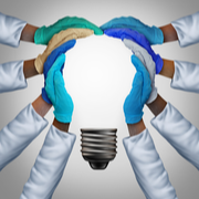 clinicians join hands to make lightbulb shape