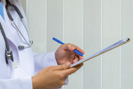doctor signing patient referral