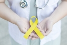 doctor holding yellow suicide prevention awareness