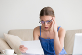 young female worried over student loan bill